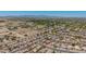 Scenic aerial shot featuring the neighborhood, distant mountains, and property with clear blue skies at 16264 W Pioneer St, Goodyear, AZ 85338