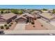 An elevated view showing the home's desert landscaping and a spacious two-car garage at 16264 W Pioneer St, Goodyear, AZ 85338