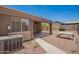An open patio in the backyard shows plenty of space for outdoor dining and relaxation at 16264 W Pioneer St, Goodyear, AZ 85338