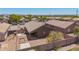View of backyard featuring gravel landscaping, block fence, and covered patio at 16264 W Pioneer St, Goodyear, AZ 85338