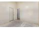 Bedroom showing a closet with sliding doors and neutral walls ready for customization at 16264 W Pioneer St, Goodyear, AZ 85338