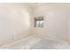 Bright bedroom with window offering natural light and neutral walls ready for customization at 16264 W Pioneer St, Goodyear, AZ 85338