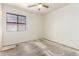 Bedroom with window allowing natural light and a ceiling fan for climate control at 16264 W Pioneer St, Goodyear, AZ 85338