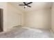 Spacious bedroom with a ceiling fan and closet providing ample storage space at 16264 W Pioneer St, Goodyear, AZ 85338