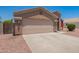 Well-maintained home featuring a clean two-car garage and desert landscaping at 16264 W Pioneer St, Goodyear, AZ 85338