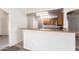 Kitchen featuring a breakfast bar with wood cabinets and plenty of counter space at 16264 W Pioneer St, Goodyear, AZ 85338
