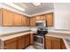 Kitchen showcases stainless steel appliances and plenty of counter space at 16264 W Pioneer St, Goodyear, AZ 85338