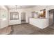Open-concept living space flows into dining area and kitchen, with lots of natural light at 16264 W Pioneer St, Goodyear, AZ 85338