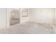 Large living room provides great natural light and a pass-through into other rooms at 16264 W Pioneer St, Goodyear, AZ 85338