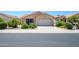 Charming single-story home featuring desert landscaping and a two-car garage at 17449 N Fairway Dr, Surprise, AZ 85374