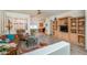 Cozy living room with hardwood floors, built-in shelving, and large windows at 17449 N Fairway Dr, Surprise, AZ 85374