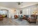 Open living space featuring hardwood floors, comfortable seating, and bright lighting at 17449 N Fairway Dr, Surprise, AZ 85374