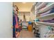 Spacious walk-in closet with ample shelving and storage for clothes and accessories at 17449 N Fairway Dr, Surprise, AZ 85374
