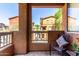 Cozy balcony view overlooks neighborhood and playground; decorated with cushions and greenery at 1920 E Bell Rd # 1165, Phoenix, AZ 85022
