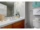 Updated bathroom with modern countertop, neutral colors, and decorative accents at 1920 E Bell Rd # 1165, Phoenix, AZ 85022