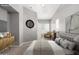 Serene bedroom with neutral decor, a comfy chair, and natural light creates a peaceful retreat at 1920 E Bell Rd # 1165, Phoenix, AZ 85022