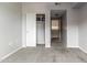 Bedroom has an open closet with shelf, neutral walls, and carpet at 1920 E Bell Rd # 1165, Phoenix, AZ 85022