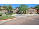 Charming clubhouse exterior featuring stone accents, arched windows, and landscaped grounds at 1920 E Bell Rd # 1165, Phoenix, AZ 85022