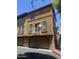 Three-story townhome featuring large windows, balcony, and two-car garage at 1920 E Bell Rd # 1165, Phoenix, AZ 85022