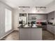 Well-lit kitchen with stainless steel appliances and granite countertops offers style and functionality at 1920 E Bell Rd # 1165, Phoenix, AZ 85022