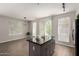 Open concept kitchen features granite counters, an island, and flows into adjacent living space at 1920 E Bell Rd # 1165, Phoenix, AZ 85022