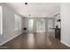 Open-concept living area with hardwood floors, bright windows, and sliding doors to the exterior at 1920 E Bell Rd # 1165, Phoenix, AZ 85022