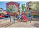 Community playground featuring colorful equipment, a mulch ground cover, and nearby parking at 1920 E Bell Rd # 1165, Phoenix, AZ 85022