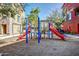 Colorful playground with slides and climbing structures surrounded by trees and mulch at 1920 E Bell Rd # 1165, Phoenix, AZ 85022