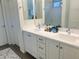 Bathroom showcasing double sinks, white cabinets, and a sleek design with a glass-enclosed shower at 20952 E Via Del Sol --, Queen Creek, AZ 85142