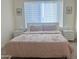 Bright bedroom featuring neutral walls, a window with blinds, and simple decor at 20952 E Via Del Sol --, Queen Creek, AZ 85142