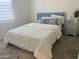 Bright bedroom featuring a cozy bed, neutral walls, and a modern nightstand at 20952 E Via Del Sol --, Queen Creek, AZ 85142