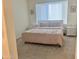 Bright bedroom featuring neutral walls, a window with blinds, and simple decor at 20952 E Via Del Sol --, Queen Creek, AZ 85142
