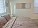 Bright bedroom featuring neutral walls, a window with blinds, and simple decor at 20952 E Via Del Sol --, Queen Creek, AZ 85142