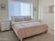 Tranquil bedroom with a comfortable bed, neutral tones, and a large window at 20952 E Via Del Sol --, Queen Creek, AZ 85142