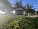 Stone community sign amidst lush greenery, showcasing the entrance to Hastings Farms at 20952 E Via Del Sol --, Queen Creek, AZ 85142