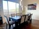 Dining room featuring a large table, soft chairs, hardwood floors, and a large window at 20952 E Via Del Sol --, Queen Creek, AZ 85142
