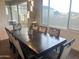Dining room featuring a large table, soft chairs, hardwood floors, and a large window at 20952 E Via Del Sol --, Queen Creek, AZ 85142