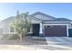 Attractive single-story home featuring a two-car garage and well-maintained front landscaping at 20952 E Via Del Sol --, Queen Creek, AZ 85142