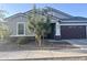Charming single-story home featuring a two-car garage and well-maintained front yard at 20952 E Via Del Sol --, Queen Creek, AZ 85142