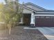Attractive single-story home featuring a two-car garage and well-maintained front landscaping at 20952 E Via Del Sol --, Queen Creek, AZ 85142