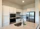 Modern kitchen featuring white cabinets, stainless steel appliances, and a spacious center island at 20952 E Via Del Sol --, Queen Creek, AZ 85142