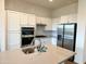Well-equipped kitchen with white cabinets, stainless steel appliances, and a central island at 20952 E Via Del Sol --, Queen Creek, AZ 85142
