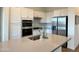 Well-equipped kitchen with stainless steel appliances, ample counter space, and modern white cabinets at 20952 E Via Del Sol --, Queen Creek, AZ 85142