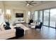 Bright and airy living room featuring tile floors, neutral tones, and a large sliding glass door at 20952 E Via Del Sol --, Queen Creek, AZ 85142