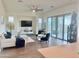 Bright living room with modern furniture, tile floors, and sliding glass doors to the patio at 20952 E Via Del Sol --, Queen Creek, AZ 85142