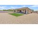 Low maintenance backyard with artificial turf and gravel at 23038 E Twilight Dr, Queen Creek, AZ 85142