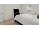 Bright bedroom with neutral color scheme, carpet flooring, and view of the neighborhood at 23038 E Twilight Dr, Queen Creek, AZ 85142
