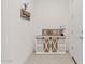 Welcoming entryway featuring stylish decor and a charming rustic storage cabinet at 23038 E Twilight Dr, Queen Creek, AZ 85142