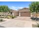 Charming single-story home featuring manicured desert landscaping and a two-car garage at 23038 E Twilight Dr, Queen Creek, AZ 85142