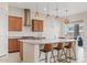Bright kitchen with stainless steel appliances, a large island, and modern pendant lights at 23038 E Twilight Dr, Queen Creek, AZ 85142
